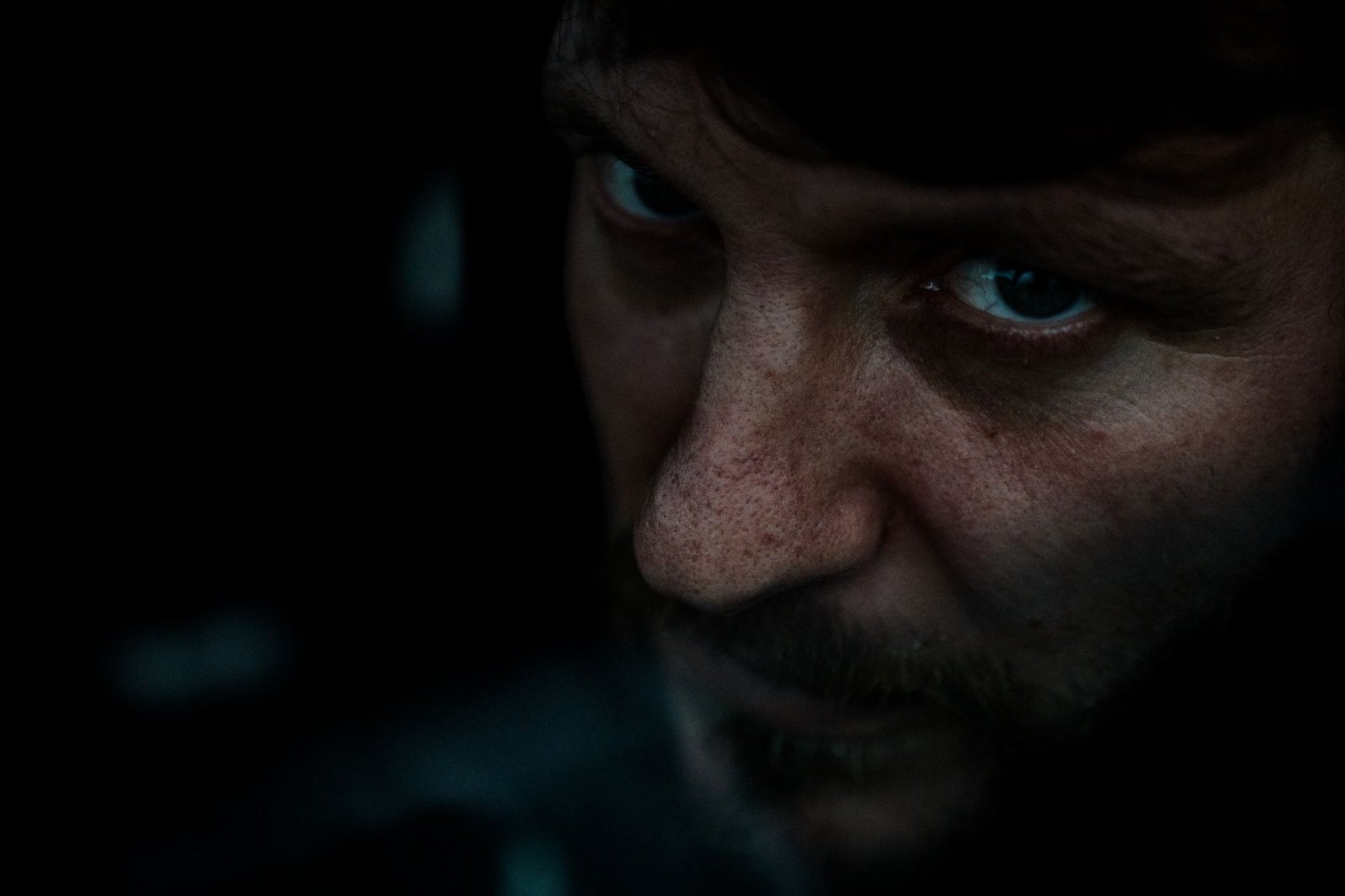 man face in dark